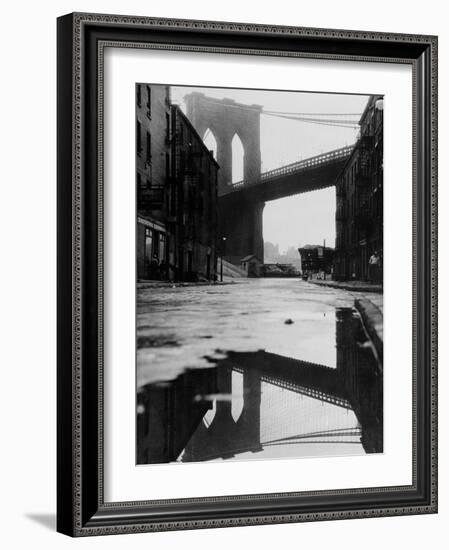 Puddle Reflecting Brooklyn Bridge-Bettmann-Framed Photographic Print