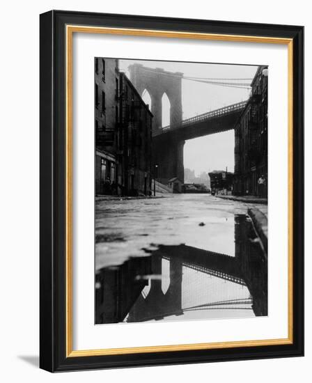 Puddle Reflecting Brooklyn Bridge-Bettmann-Framed Photographic Print