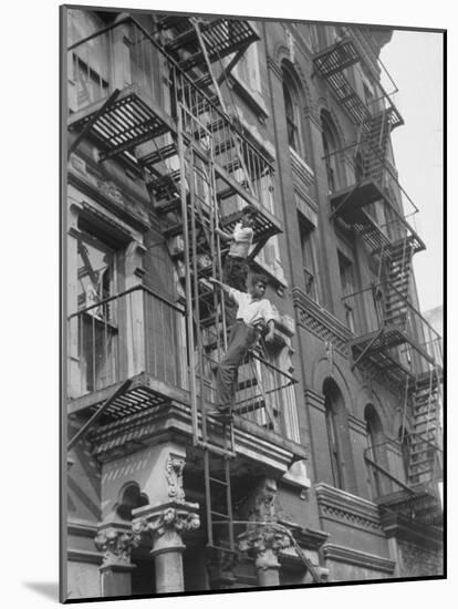 Puerto Rican Boys Climbing on Tenement Fire Escape-Al Fenn-Mounted Photographic Print