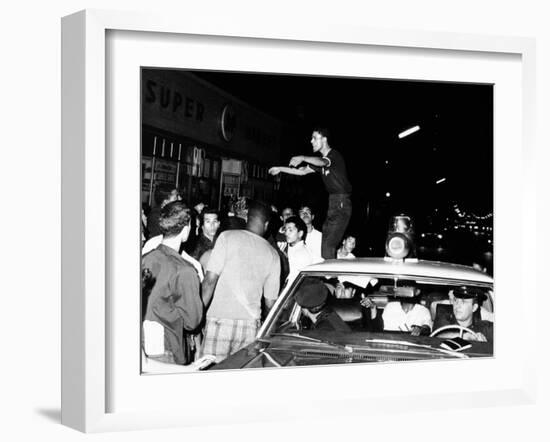 Puerto Rican Youth Urges the Crowd to Go Home and Aid in Dispersing Neighborhood Groups-null-Framed Photo