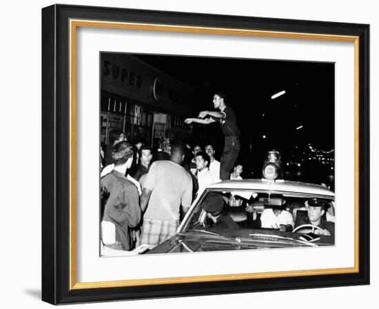 Puerto Rican Youth Urges the Crowd to Go Home and Aid in Dispersing Neighborhood Groups-null-Framed Photo