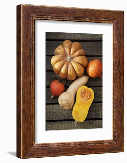 Pumpkin, Butternut- and Hokkaido Squashes on Wooden Background-Fotos mit Geschmack-Framed Photographic Print