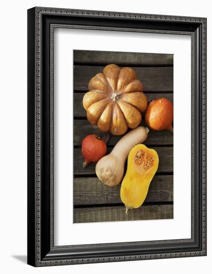 Pumpkin, Butternut- and Hokkaido Squashes on Wooden Background-Fotos mit Geschmack-Framed Photographic Print