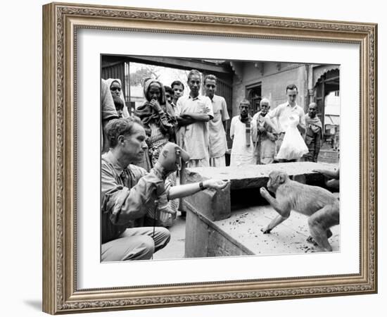 Puppeteer Bil Baird playing with a monkey, March 1962.-James Burke-Framed Premium Photographic Print