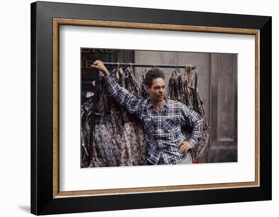 Push Boy as He Leans Against a Racks of Dresses in the Garment District, New York, New York, 1960-Walter Sanders-Framed Photographic Print