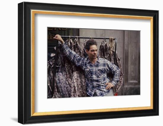 Push Boy as He Leans Against a Racks of Dresses in the Garment District, New York, New York, 1960-Walter Sanders-Framed Photographic Print