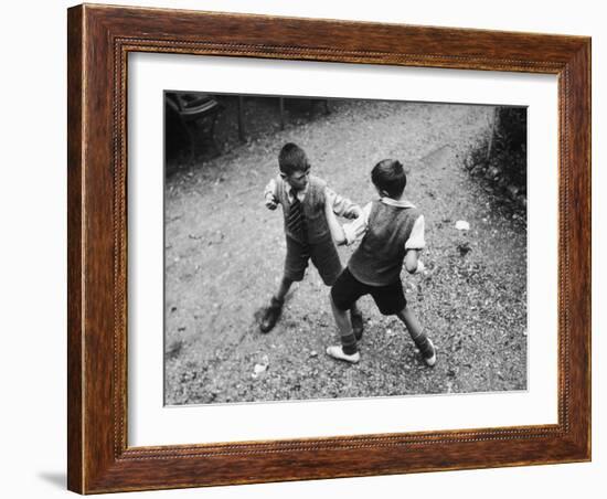 Put 'Em Up!' Two Boys Enjoy a Game of Fisticuffs in a Garden or Playground-null-Framed Photographic Print