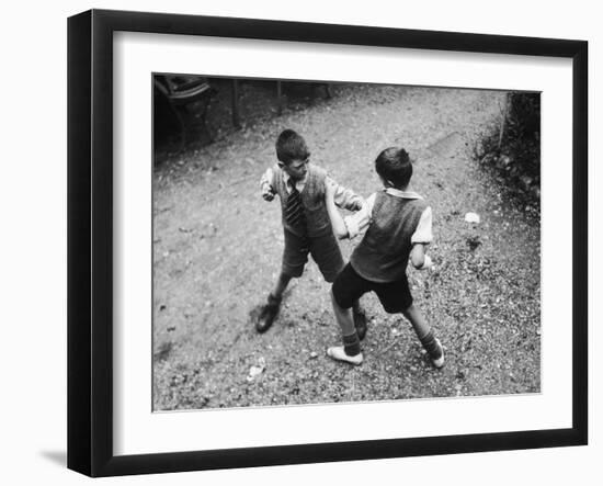 Put 'Em Up!' Two Boys Enjoy a Game of Fisticuffs in a Garden or Playground-null-Framed Photographic Print