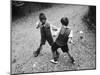 Put 'Em Up!' Two Boys Enjoy a Game of Fisticuffs in a Garden or Playground-null-Mounted Photographic Print