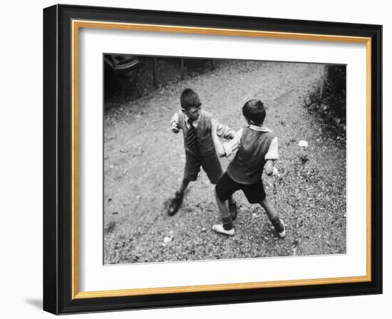 Put 'Em Up!' Two Boys Enjoy a Game of Fisticuffs in a Garden or Playground-null-Framed Photographic Print