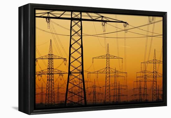 Pylons and power lines in morning light, Germany, Europe-Hans-Peter Merten-Framed Premier Image Canvas