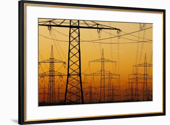 Pylons and power lines in morning light, Germany, Europe-Hans-Peter Merten-Framed Photographic Print