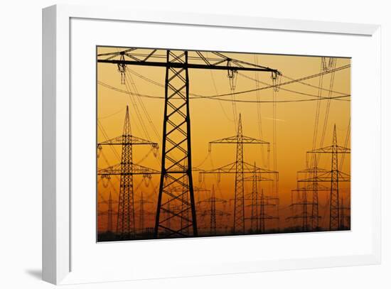 Pylons and power lines in morning light, Germany, Europe-Hans-Peter Merten-Framed Photographic Print