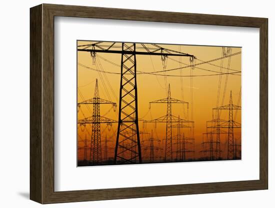 Pylons and power lines in morning light, Germany, Europe-Hans-Peter Merten-Framed Photographic Print