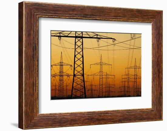 Pylons and power lines in morning light, Germany, Europe-Hans-Peter Merten-Framed Photographic Print