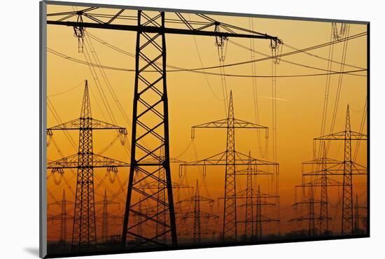 Pylons and power lines in morning light, Germany, Europe-Hans-Peter Merten-Mounted Photographic Print