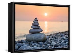 Pyramid of Stones for Meditation Lying on Sea Coast at Sunset-Maxim Blinkov-Framed Premier Image Canvas