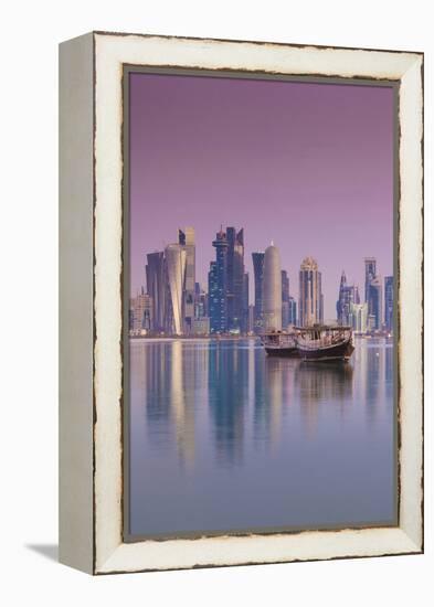 Qatar, Doha, Dhows on Doha Bay with West Bay Skyscrapers, Dawn-Walter Bibikow-Framed Premier Image Canvas