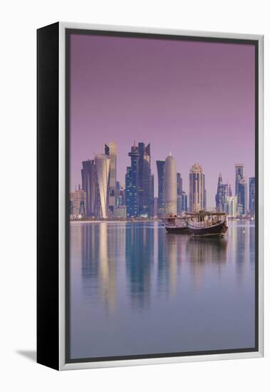 Qatar, Doha, Dhows on Doha Bay with West Bay Skyscrapers, Dawn-Walter Bibikow-Framed Premier Image Canvas