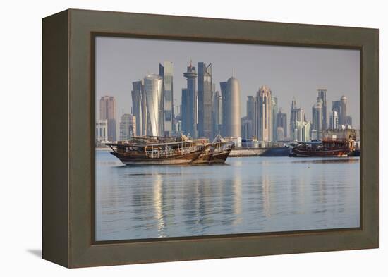 Qatar, Doha, Dhows on Doha Bay with West Bay Skyscrapers, Dawn-Walter Bibikow-Framed Premier Image Canvas