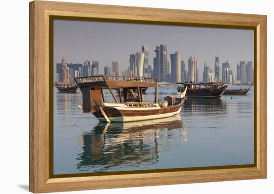 Qatar, Doha, Dhows on Doha Bay with West Bay Skyscrapers, Dawn-Walter Bibikow-Framed Premier Image Canvas