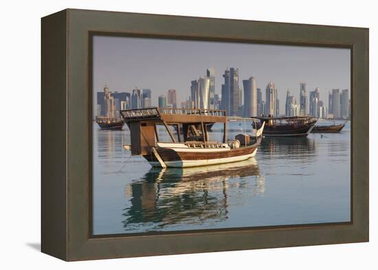 Qatar, Doha, Dhows on Doha Bay with West Bay Skyscrapers, Dawn-Walter Bibikow-Framed Premier Image Canvas