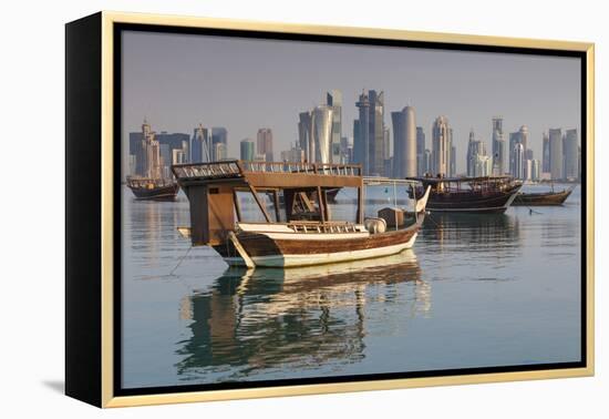 Qatar, Doha, Dhows on Doha Bay with West Bay Skyscrapers, Dawn-Walter Bibikow-Framed Premier Image Canvas