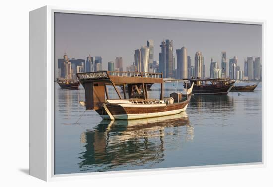 Qatar, Doha, Dhows on Doha Bay with West Bay Skyscrapers, Dawn-Walter Bibikow-Framed Premier Image Canvas