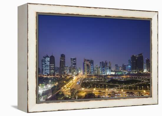 Qatar, Doha, Doha Bay, West Bay Skyscrapers, Elevated View, Dusk-Walter Bibikow-Framed Premier Image Canvas