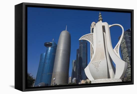 Qatar, Doha, Doha Bay, West Bay Skyscrapers, Morning, with Large Coffeepot Sculpture-Walter Bibikow-Framed Premier Image Canvas