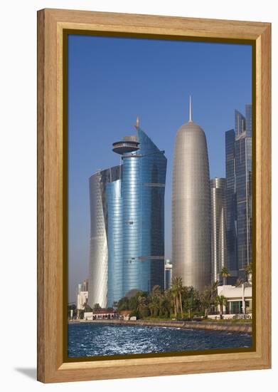 Qatar, Doha, Doha Bay, West Bay Skyscrapers with World Trade Center and Burj Qatar-Walter Bibikow-Framed Premier Image Canvas