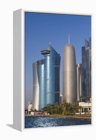 Qatar, Doha, Doha Bay, West Bay Skyscrapers with World Trade Center and Burj Qatar-Walter Bibikow-Framed Premier Image Canvas