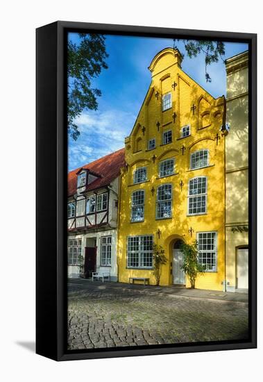 Quaint Yellow House In Old Town Lubeck-George Oze-Framed Premier Image Canvas