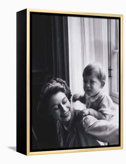 Queen Elizabeth and Prince Charles at Buckingham Palace, London, England-Cecil Beaton-Framed Premier Image Canvas
