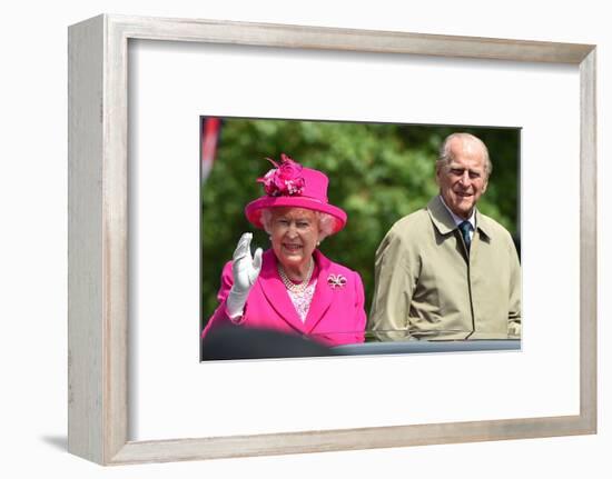 Queen Elizabeth II and Prince Philip wave to the crowd at her 90th birthday celebrations-Associated Newspapers-Framed Photo