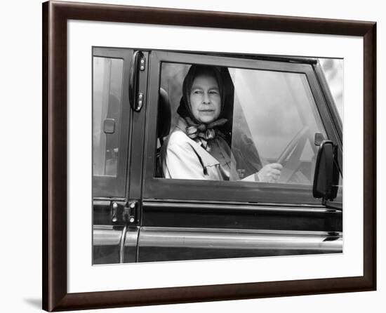Queen Elizabeth II at the wheel of her Land Rover-Associated Newspapers-Framed Photo