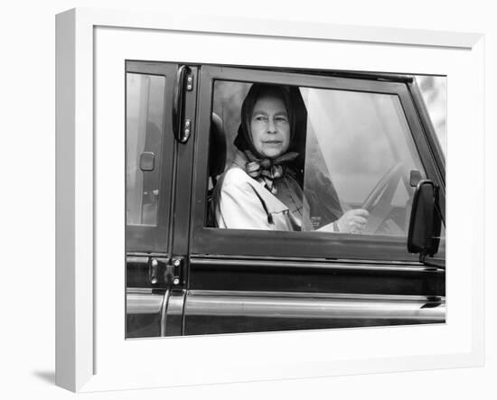 Queen Elizabeth II at the wheel of her Land Rover-Associated Newspapers-Framed Photo