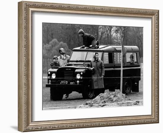 Queen Elizabeth II Looks on as Prince Edward Plays on the Roof of Their Land Rover-null-Framed Photographic Print