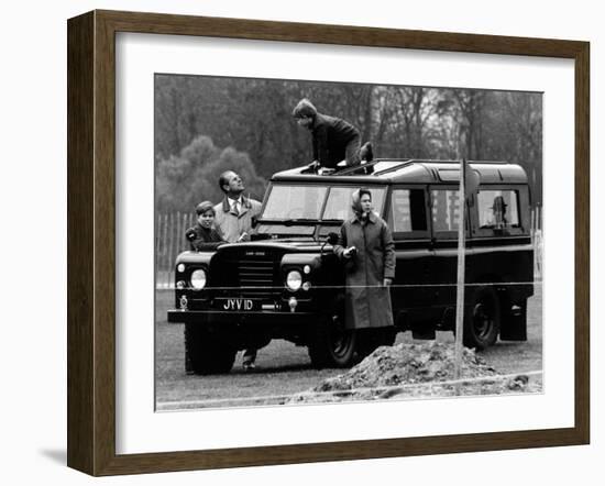 Queen Elizabeth II Looks on as Prince Edward Plays on the Roof of Their Land Rover-null-Framed Photographic Print