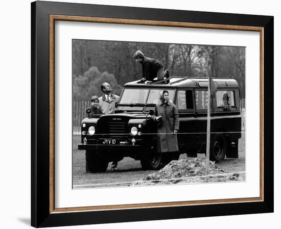 Queen Elizabeth II Looks on as Prince Edward Plays on the Roof of Their Land Rover-null-Framed Photographic Print