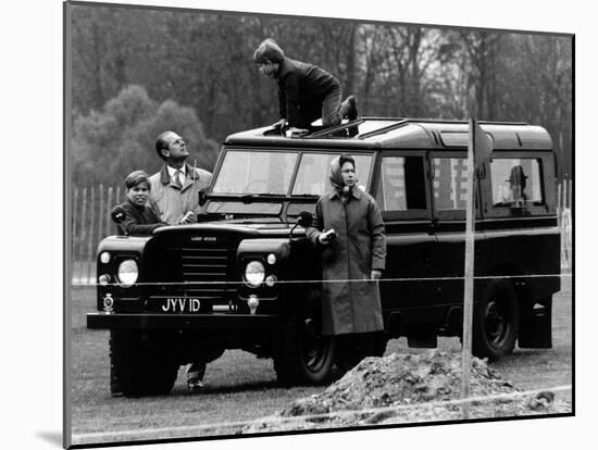 Queen Elizabeth II Looks on as Prince Edward Plays on the Roof of Their Land Rover-null-Mounted Photographic Print