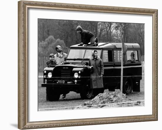 Queen Elizabeth II Looks on as Prince Edward Plays on the Roof of Their Land Rover-null-Framed Photographic Print