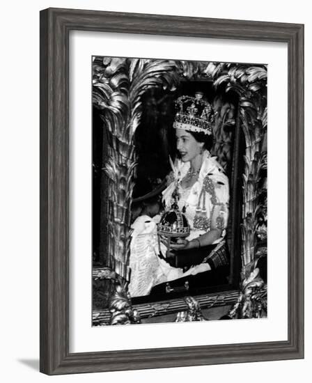 Queen Elizabeth II Riding Along in the Coronation Coach Wearing Crown and Carrying Orb-null-Framed Photographic Print