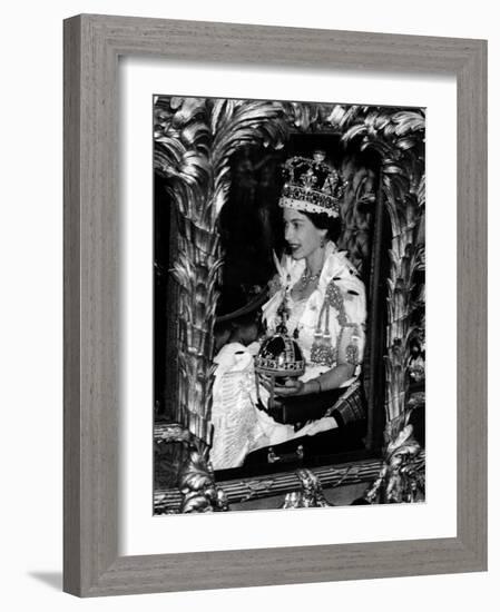 Queen Elizabeth II Riding Along in the Coronation Coach Wearing Crown and Carrying Orb-null-Framed Photographic Print