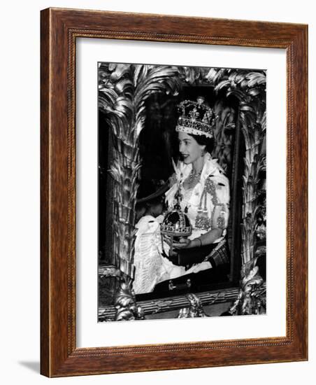 Queen Elizabeth II Riding Along in the Coronation Coach Wearing Crown and Carrying Orb-null-Framed Photographic Print