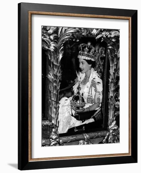 Queen Elizabeth II Riding Along in the Coronation Coach Wearing Crown and Carrying Orb-null-Framed Photographic Print