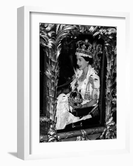 Queen Elizabeth II Riding Along in the Coronation Coach Wearing Crown and Carrying Orb-null-Framed Photographic Print