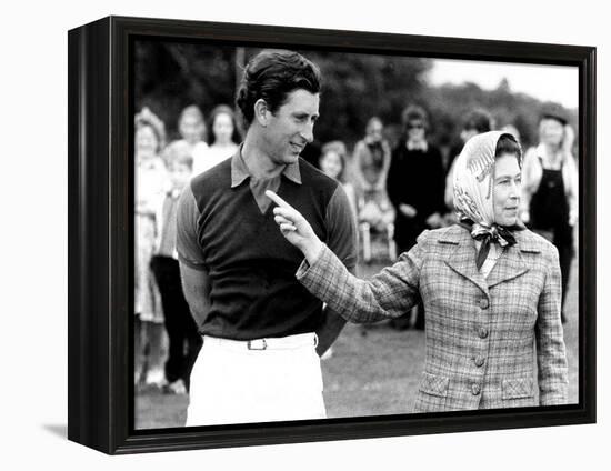 Queen Elizabeth II Shows Prince Charles Sign at a Polo Match at Windsor Great Park Points Finger-null-Framed Premier Image Canvas