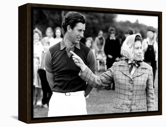 Queen Elizabeth II Shows Prince Charles Sign at a Polo Match at Windsor Great Park Points Finger-null-Framed Premier Image Canvas
