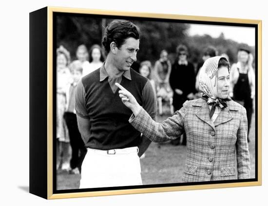 Queen Elizabeth II Shows Prince Charles Sign at a Polo Match at Windsor Great Park Points Finger-null-Framed Premier Image Canvas